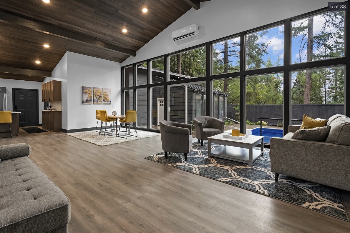 Whitefish City 4 bed 3 bath full remodel — living room with floor-to-ceiling glass wall — Homeworks Montana